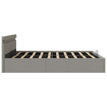 hydraulisk opbevaringsseng med LED 180x200 cm stof lysegrå