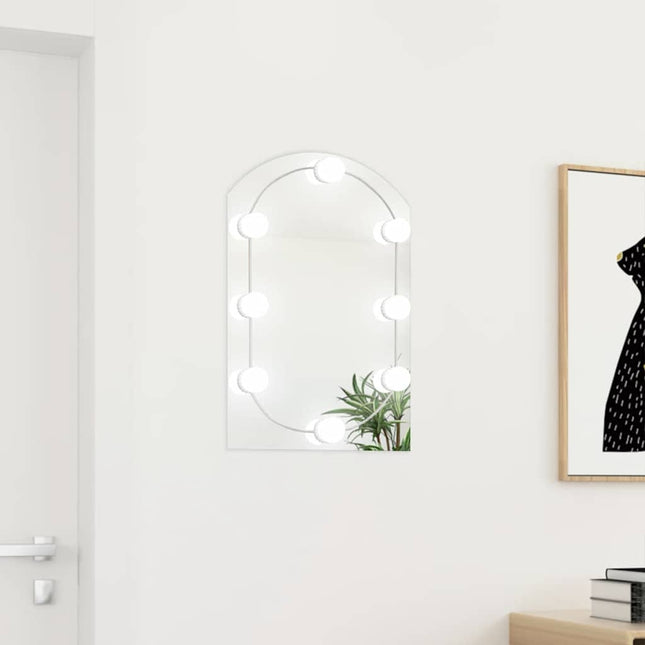 spejl med LED-lamper 60x40 cm buet glas