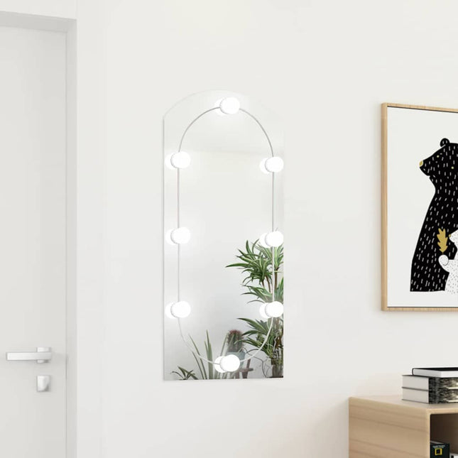 spejl med LED-lamper 90x45 cm buet glas