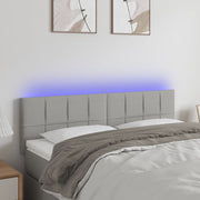 sengegavl med LED-lys 144x5x78/88 cm stof lysegrå