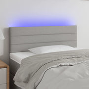 sengegavl med LED-lys 90x5x78/88 cm stof lysegrå