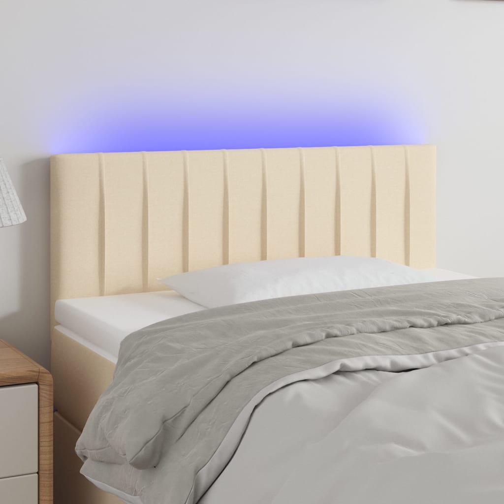 sengegavl med LED-lys 80x5x78/88 cm stof cremefarvet