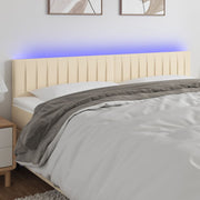 sengegavl med LED-lys 180x5x78/88 cm stof cremefarvet