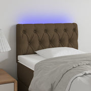 sengegavl med LED-lys 80x7x78/88 cm stof mørkebrun