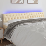 sengegavl med LED-lys 180x7x78/88 cm stof cremefarvet