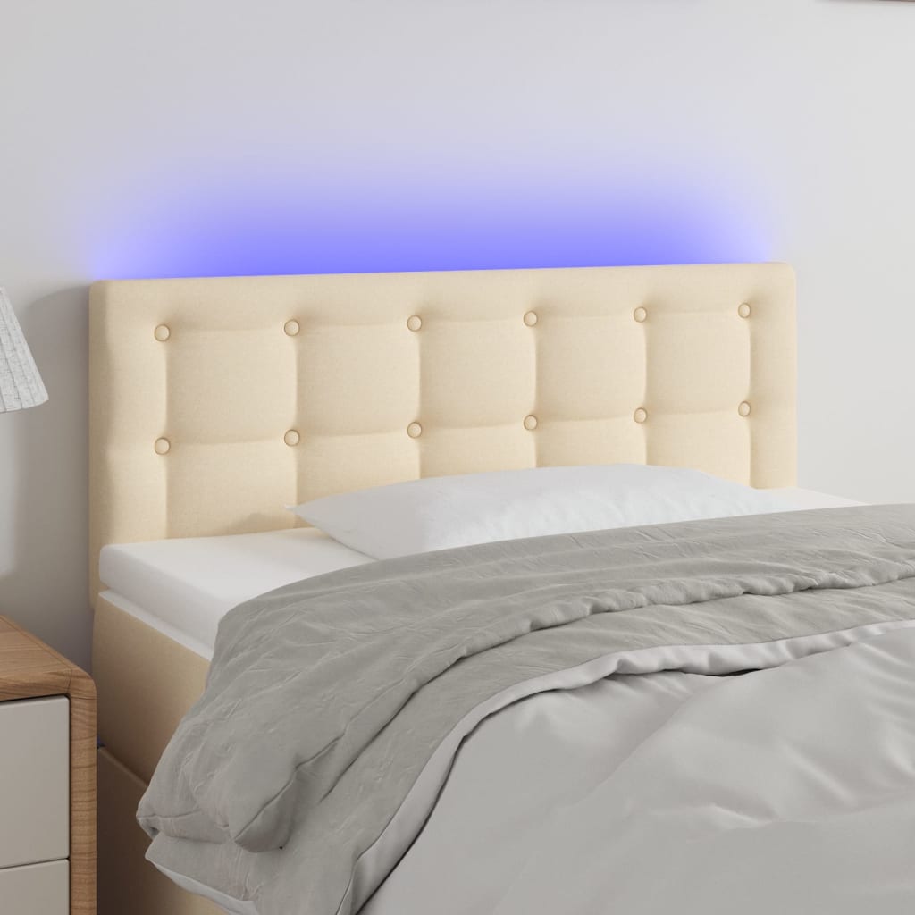 sengegavl med LED-lys 90x5x78/88 cm stof cremefarvet
