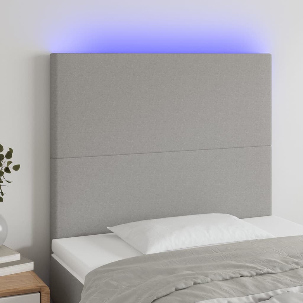 sengegavl med LED-lys 90x5x118/128 cm stof lysegrå