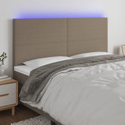 sengegavl med LED-lys 200x5x118/128 cm stof gråbrun