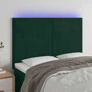 sengegavl med LED-lys 144x5x118/128 cm fløjl mørkegrøn