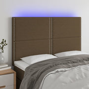 sengegavl med LED-lys 144x5x118/128 cm stof mørkebrun