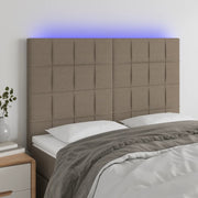 sengegavl med LED-lys 144x5x118/128 cm stof gråbrun