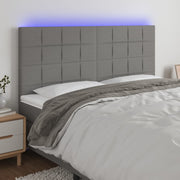 sengegavl med LED-lys 200x5x118/128 cm stof mørkegrå
