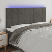 sengegavl med LED-lys 160x5x118/128 cm fløjl mørkegrå