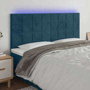 sengegavl med LED-lys 160x5x118/128 cm fløjl mørkeblå