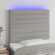 sengegavl med LED-lys 80x5x118/128 cm stof lysegrå