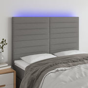 sengegavl med LED-lys 144x5x118/128 cm stof mørkegrå