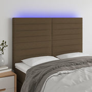 sengegavl med LED-lys 144x5x118/128 cm stof mørkebrun