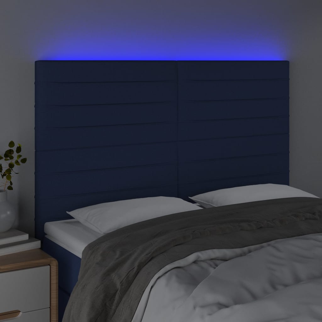 sengegavl med LED-lys 144x5x118/128 cm stof blå