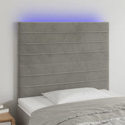 sengegavl med LED-lys 90x5x118/128 cm fløjl lysegrå