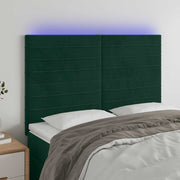 sengegavl med LED-lys 144x5x118/128 cm fløjl mørkegrøn