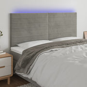 sengegavl med LED-lys 160x5x118/128 cm fløjl lysegrå