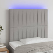 sengegavl med LED-lys 80x5x118/128 cm stof lysegrå