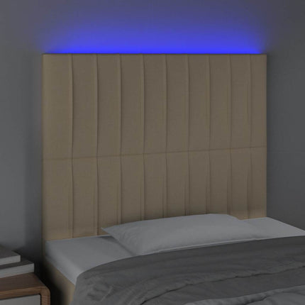sengegavl med LED-lys 90x5x118/128 cm stof cremefarvet