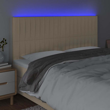 sengegavl med LED-lys 160x5x118/128 cm stof cremefarvet