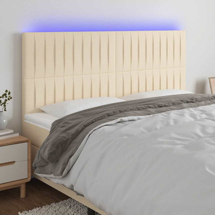 sengegavl med LED-lys 160x5x118/128 cm stof cremefarvet
