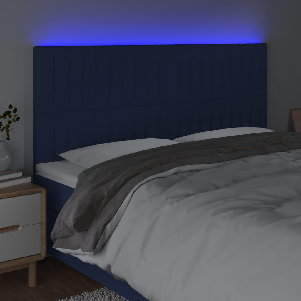 sengegavl med LED-lys 180x5x118/128 cm stof blå