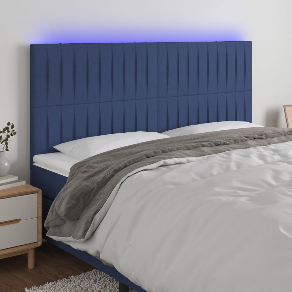 sengegavl med LED-lys 180x5x118/128 cm stof blå