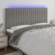 sengegavl med LED-lys 200x5x118/128 cm stof mørkegrå