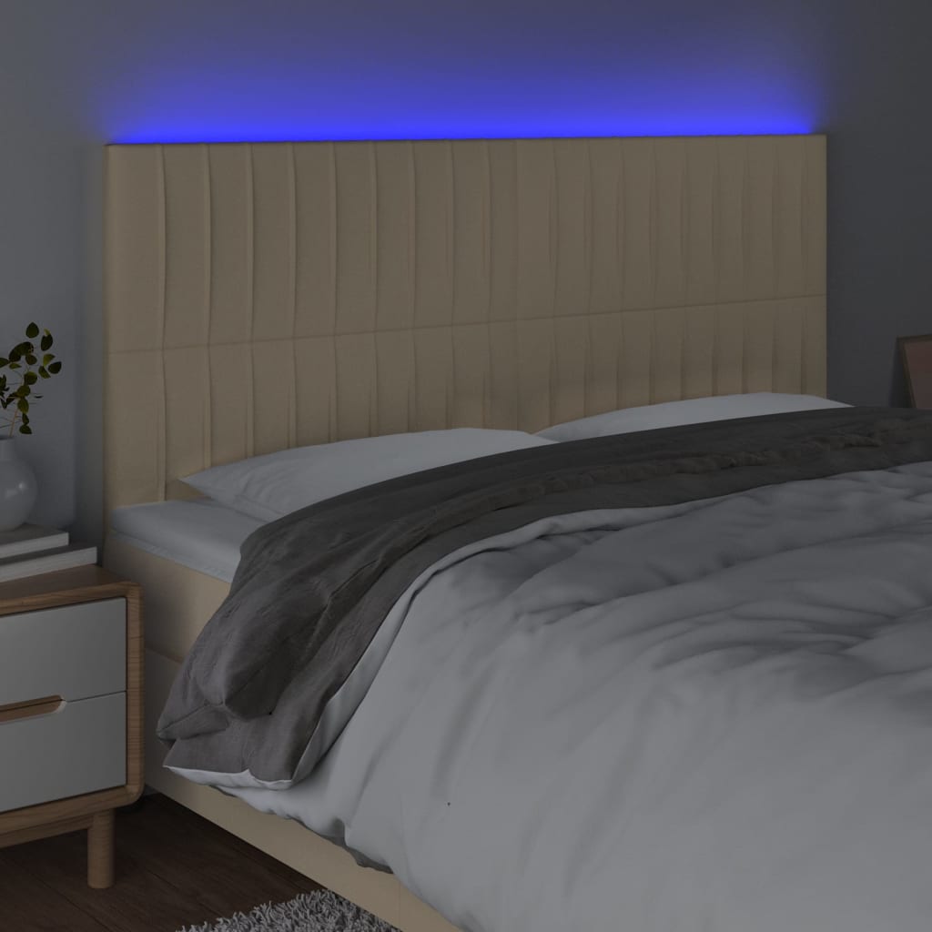 sengegavl med LED-lys 200x5x118/128 cm stof Cremefarvet