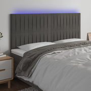 sengegavl med LED-lys 180x5x118/128 cm fløjl mørkegrå