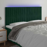 sengegavl med LED-lys 180x5x118/128 cm fløjl mørkegrøn