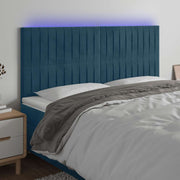 sengegavl med LED-lys 180x5x118/128 cm fløjl mørkeblå
