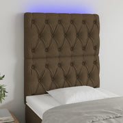 sengegavl med LED-lys 80x7x118/128 cm stof mørkebrun
