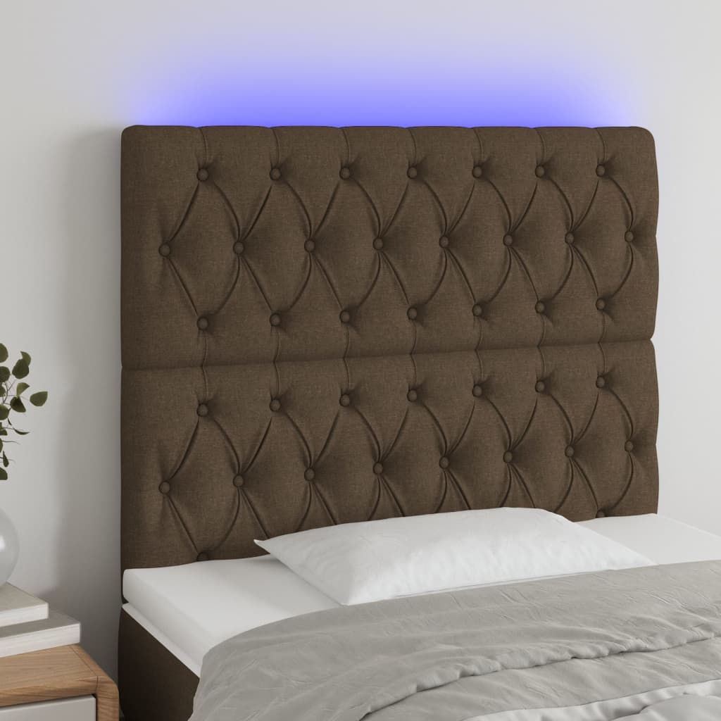 sengegavl med LED-lys 100x7x118/128 cm stof mørkebrun