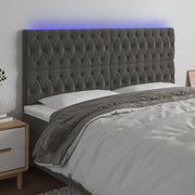 sengegavl med LED-lys 180x7x118/128 cm fløjl mørkegrå