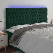 sengegavl med LED-lys 200x7x118/128 cm fløjl mørkegrøn