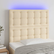 sengegavl med LED-lys 100x5x118/128 cm stof cremefarvet