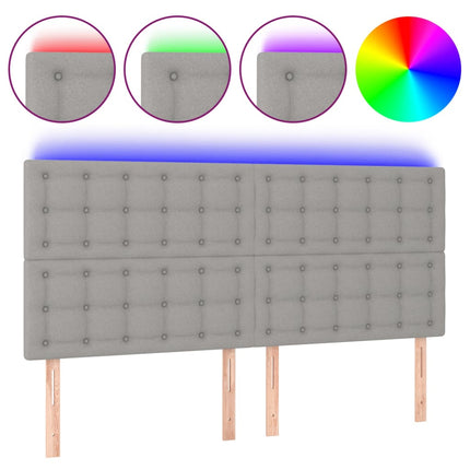 sengegavl med LED-lys 160x5x118/128 cm stof lysegrå