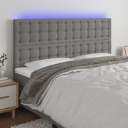 sengegavl med LED-lys 180x5x118/128 cm stof mørkegrå