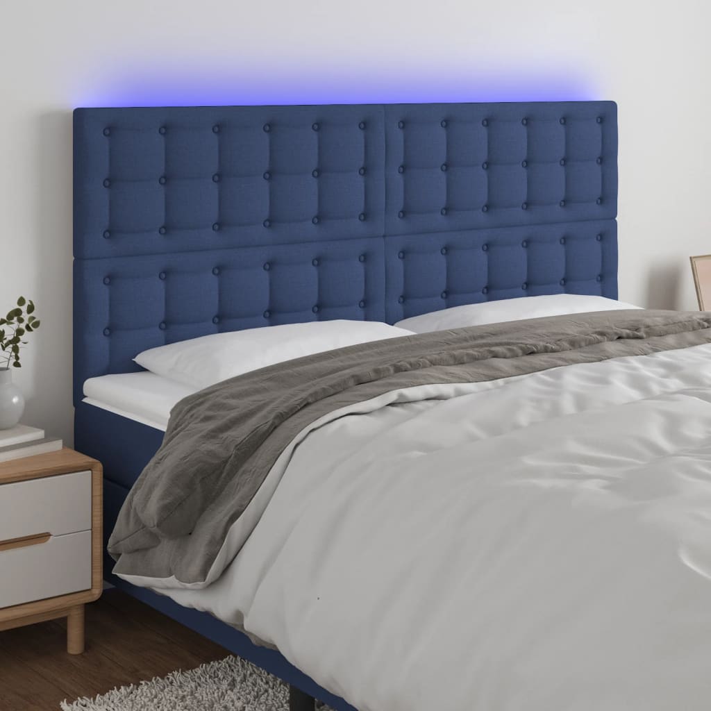 sengegavl med LED-lys 180x5x118/128 cm stof blå