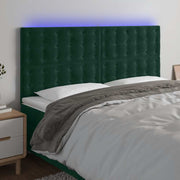 sengegavl med LED-lys 180x5x118/128 cm fløjl mørkegrøn