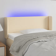 sengegavl med LED-lys 83x16x78/88 cm stof cremefarvet