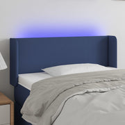 sengegavl med LED-lys 83x16x78/88 cm stof blå