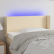 sengegavl med LED-lys 93x16x78/88 cm stof cremefarvet