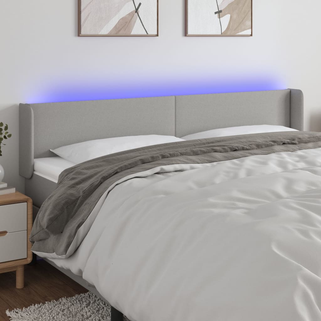 sengegavl med LED-lys 163x16x78/88 cm stof lysegrå