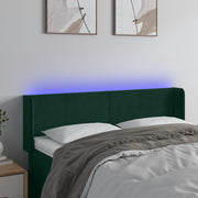 sengegavl med LED-lys 147x16x78/88 cm fløjl mørkegrøn